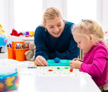 Image showing an adult talking to a child.