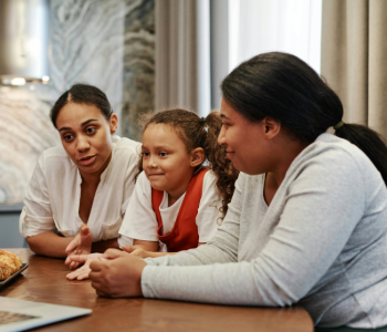 Image of two adults and a child.